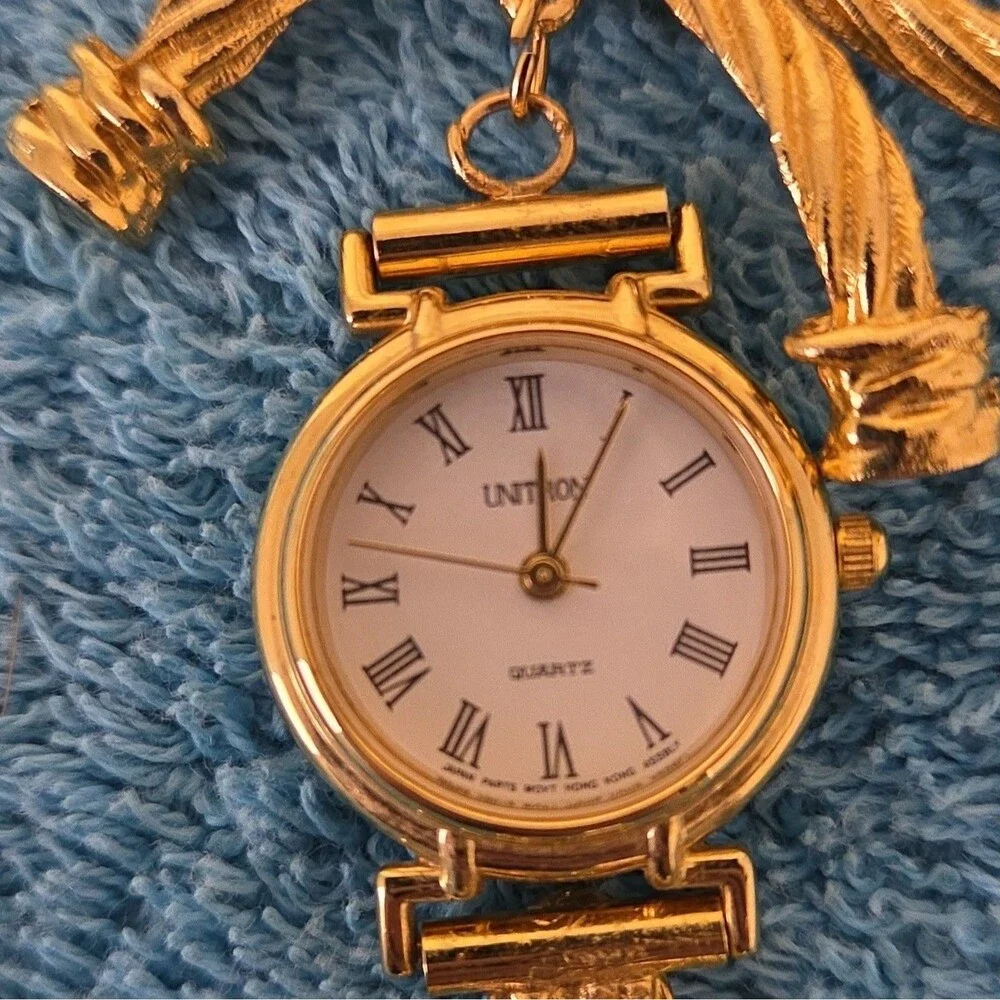 Univox Women's Quartz Gold Tone Dress Watch White Dial Roman Numerals Bracelet